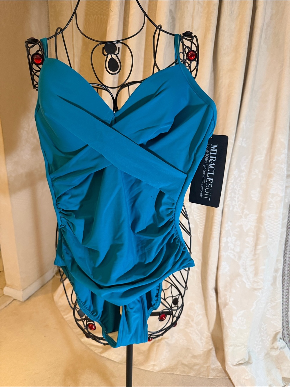 Miraclesuit Teal Blue Ruched Crossover Swim One-Piece. You will look 10lbs less